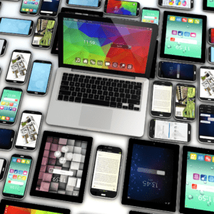 Aerial view of a table with numerous different devices on it, depicting the connection between our devices, cookies, and the digital world.